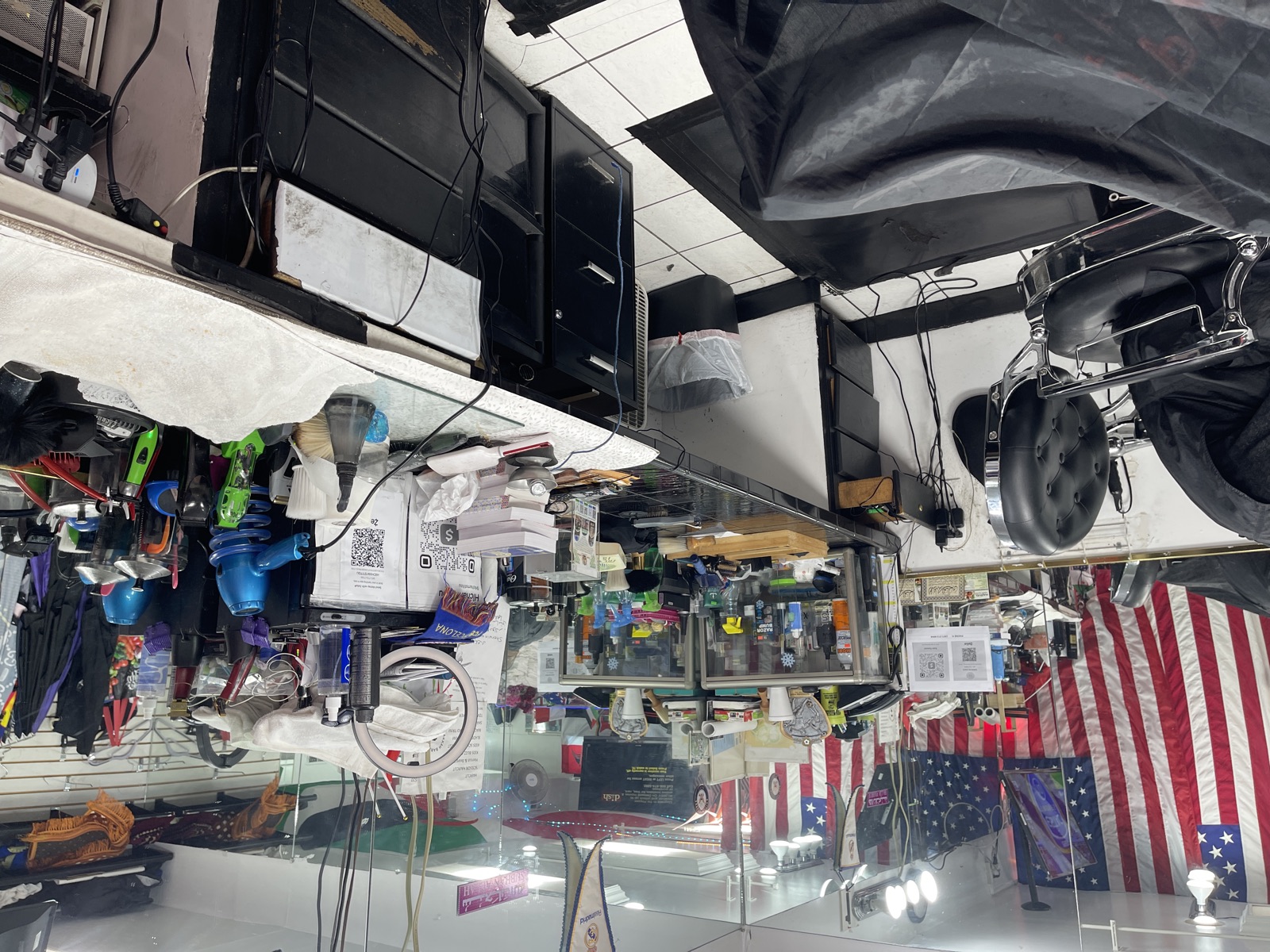 A barber station lined with clippers, combs, and tools